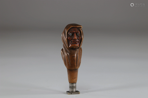 Grotesque head carved wooden seal