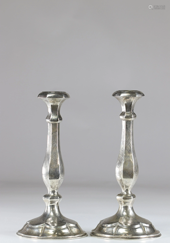 Pair of silver candlesticks with floral decoration