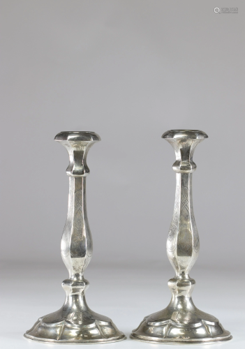 Pair of silver candlesticks with floral decoration
