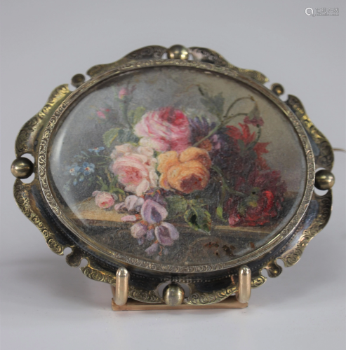 Brooch decorated with a beautiful painting of flowers