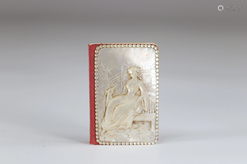 Carved mother-of-pearl ball book of a young woman with