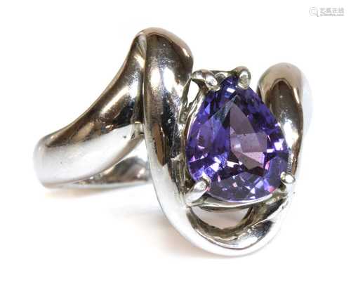 A 9ct white gold single stone purple sapphire ring,