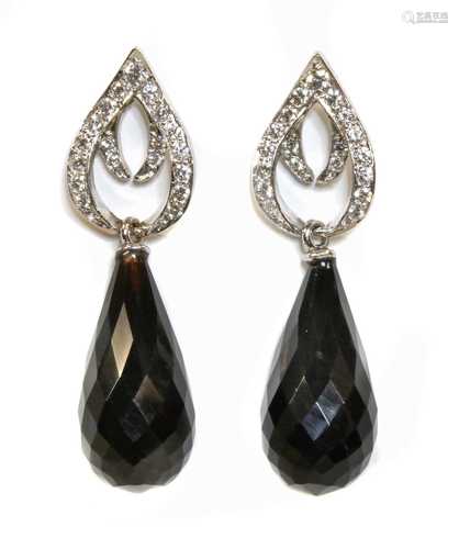 A pair of 18ct white gold diamond and onyx set drop earrings...