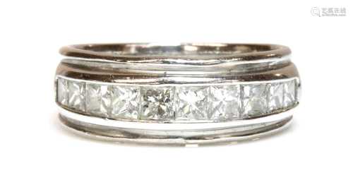 An 18ct white gold diamond half eternity ring,