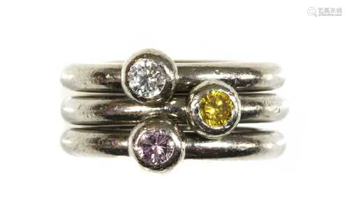 A set of three 18ct white gold diamond set stacker rings,