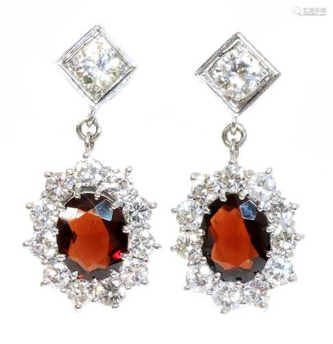 A pair of 18ct white gold garnet and diamond cluster drop ea...