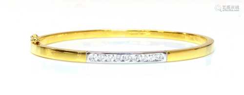 An 18ct two colour gold diamond set hinged bangle,