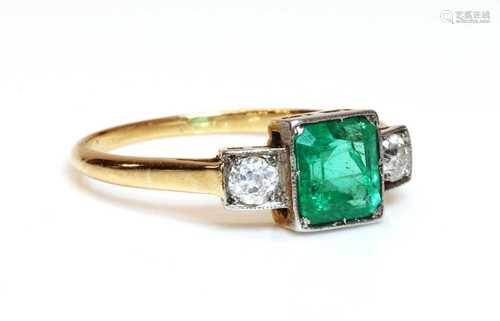 A three stone emerald and diamond ring,