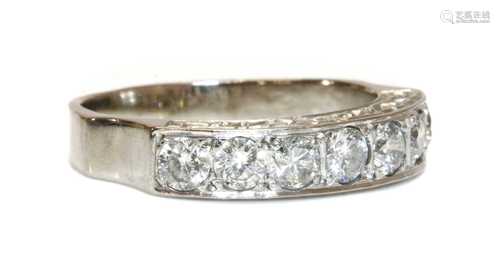 An 18ct white gold seven stone diamond half eternity ring,