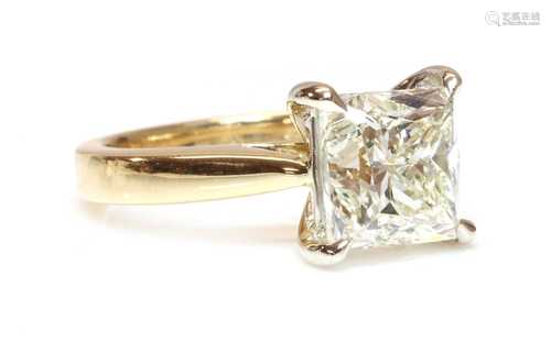 An 18ct gold single stone princess cut diamond ring, with a ...