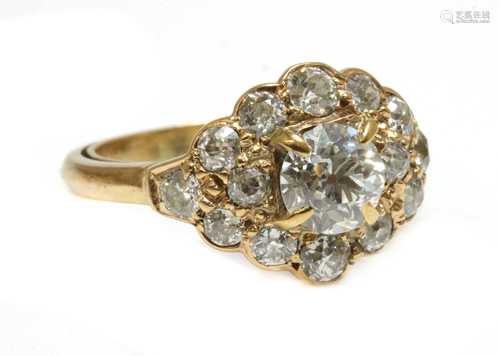 A lozenge shaped diamond cluster ring,