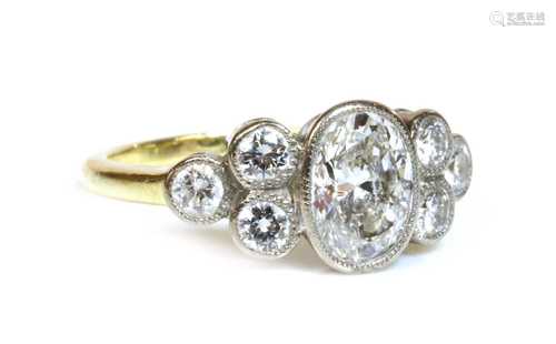 Property of a Lady. A two colour gold seven stone diamond ri...