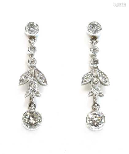 A pair of platinum diamond drop earrings,