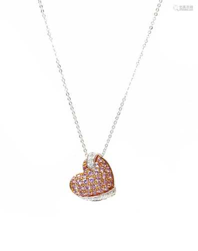 A pink sapphire and diamond heart pendant, retailed by Thurl...