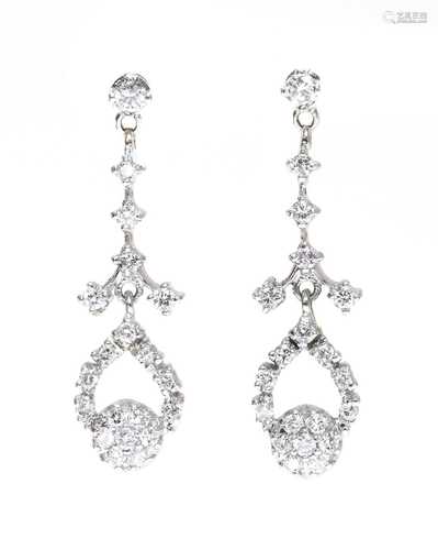 A pair of American diamond set drop earrings,