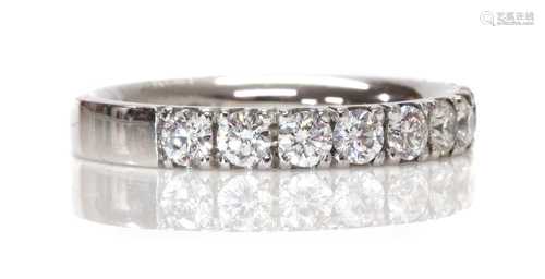 A platinum diamond set half eternity ring,