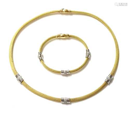 An 18ct yellow and white gold diamond set necklace and brace...