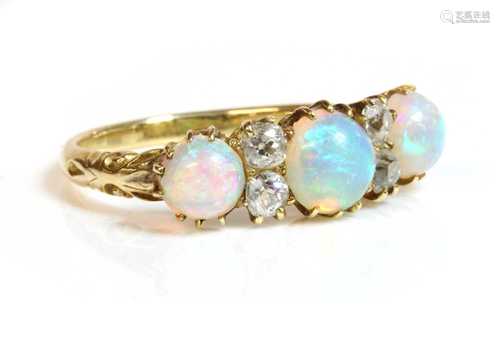 A Victorian seven stone opal and diamond carved head style r...