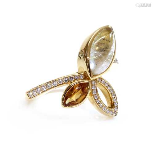 An 18ct gold rutilated golden quartz, citrine and diamond se...