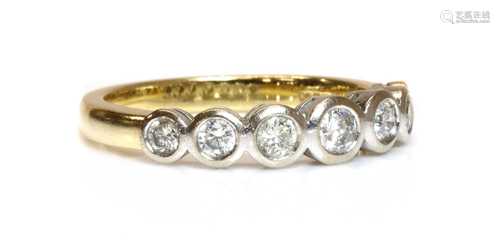 An 18ct two colour gold seven stone graduated diamond ring,