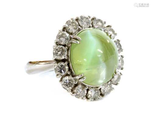 A platinum, chrysoberyl cat's eye and diamond oval cluster r...