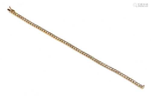 An 18ct gold diamond set line bracelet, retailed by Hamilton...