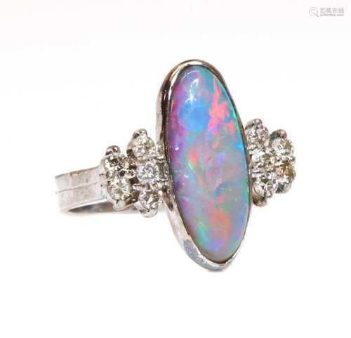 A white gold opal doublet and diamond ring,