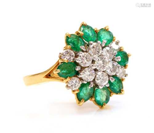 A two colour gold, diamond and emerald cluster ring,