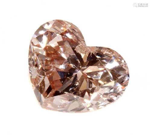 An unmounted fancy pink heart shaped brilliant cut diamond,