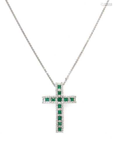 An 18ct white gold emerald and diamond Latin style cross,