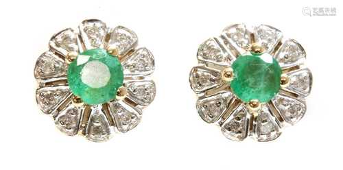 A pair of 9ct gold emerald and diamond circular cluster earr...