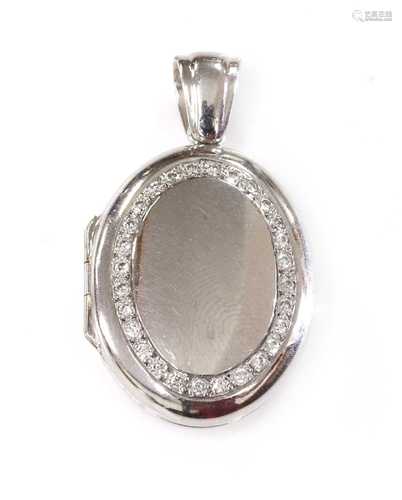 An 18ct white gold diamond set hinged locket, by Charles Gre...