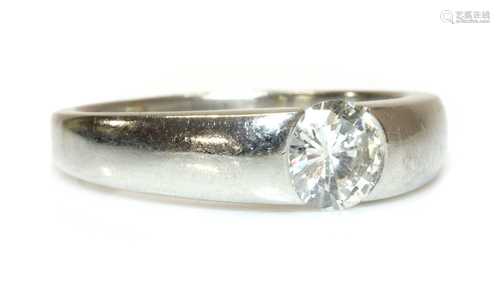 A platinum single stone gypsy or Prussian style ring,