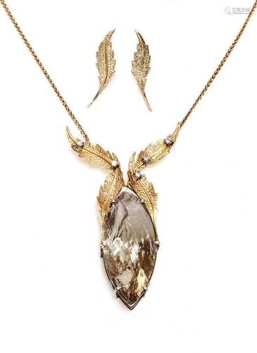 An 18ct two colour gold smoky quartz and diamond necklace an...