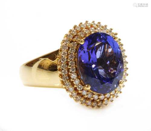 An 18ct gold tanzanite and diamond cluster ring,