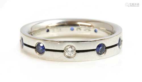 A Swiss platinum diamond and sapphire set band ring, by Furr...