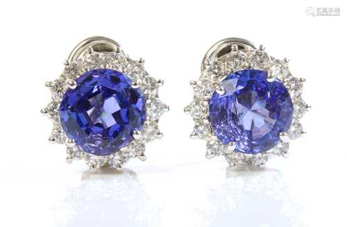 A pair of 18ct white gold tanzanite and diamond cluster earr...