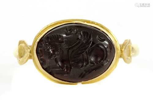 A Byzantine gentlemen's high carat gold cabochon garnet inta...