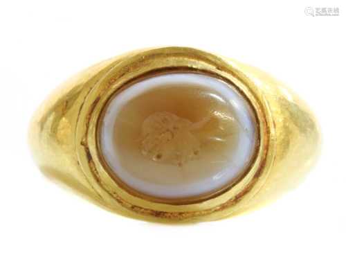 A Roman gentlemen's high carat gold 'eye' agate intaglio rin...