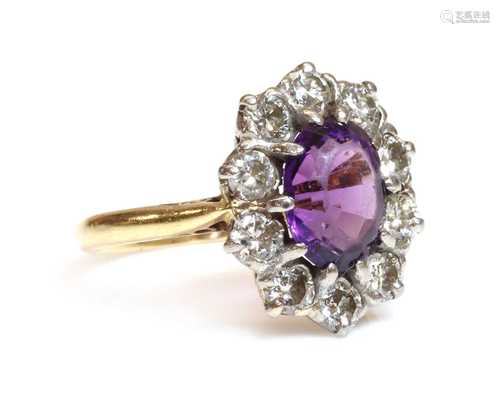 An 18ct gold amethyst and diamond cluster ring, by Arthur & ...