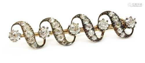 A late Victorian diamond set ribbon bar brooch, c.1880,