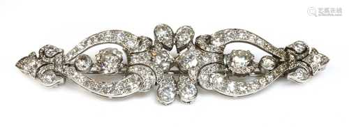 A diamond set bar brooch,