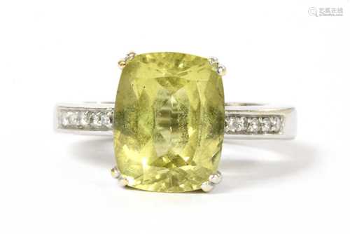 A gold heliodor and diamond ring,