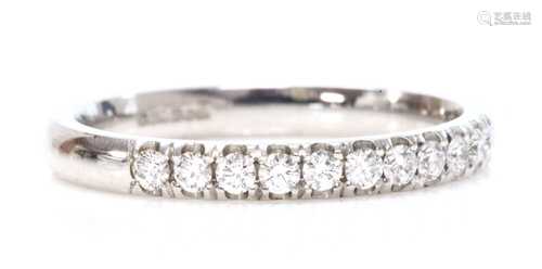 An 18ct white gold diamond set half eternity ring,