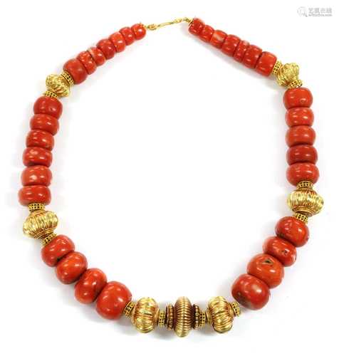 A single row graduated coral and high carat gold bead neckla...