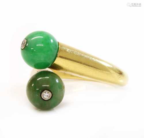 A two stone jade bead and diamond crossover ring, by Cartier...