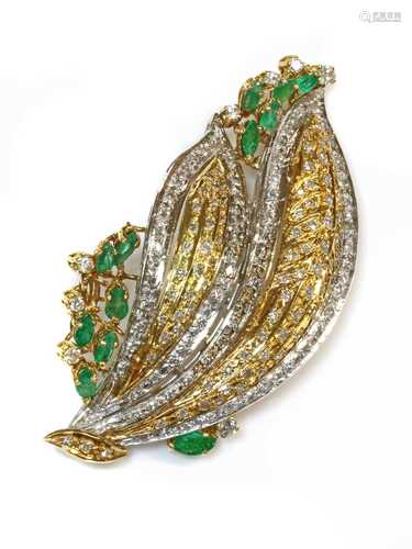 A two colour gold emerald and diamond spray brooch/pendant,