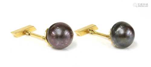 A pair of single stone cultured South Sea pearl cufflinks,