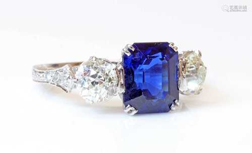 A three stone sapphire and diamond ring,