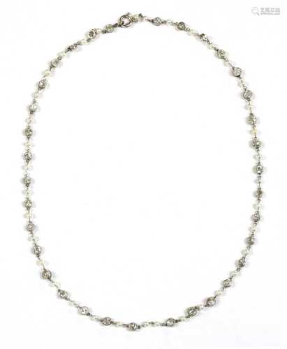 A platinum diamond and seed pearl necklace,